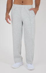 Light gray straight leg pants with relaxed fit, elastic waistband, side pockets, and soft fabric texture, worn with white.