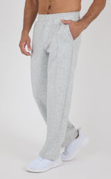 Light gray straight-leg pants with soft fabric, elastic waistband, and side pockets modeled from waist down.
