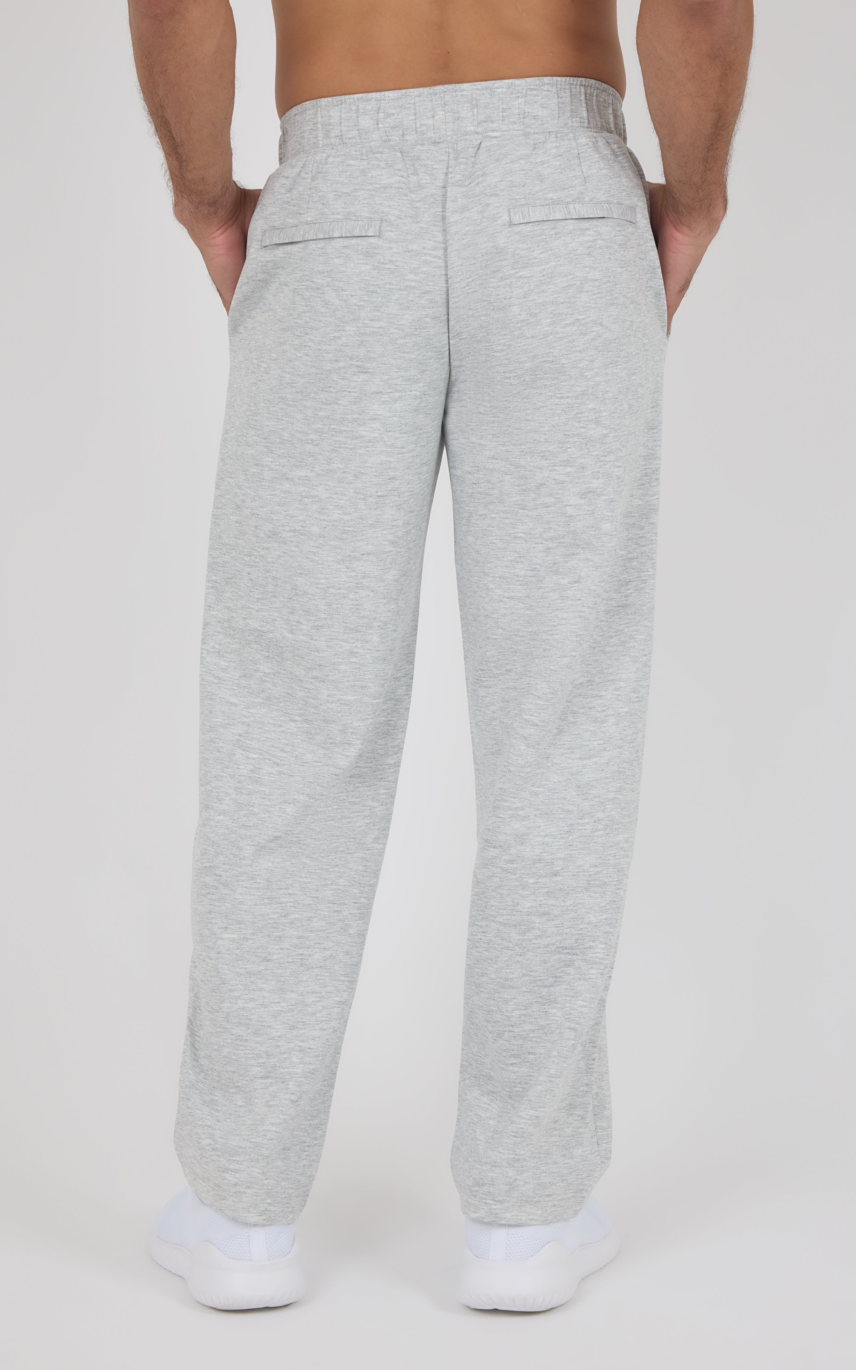 Light gray straight-leg pants with an elastic waistband and two back patch pockets, made from soft knit fabric.