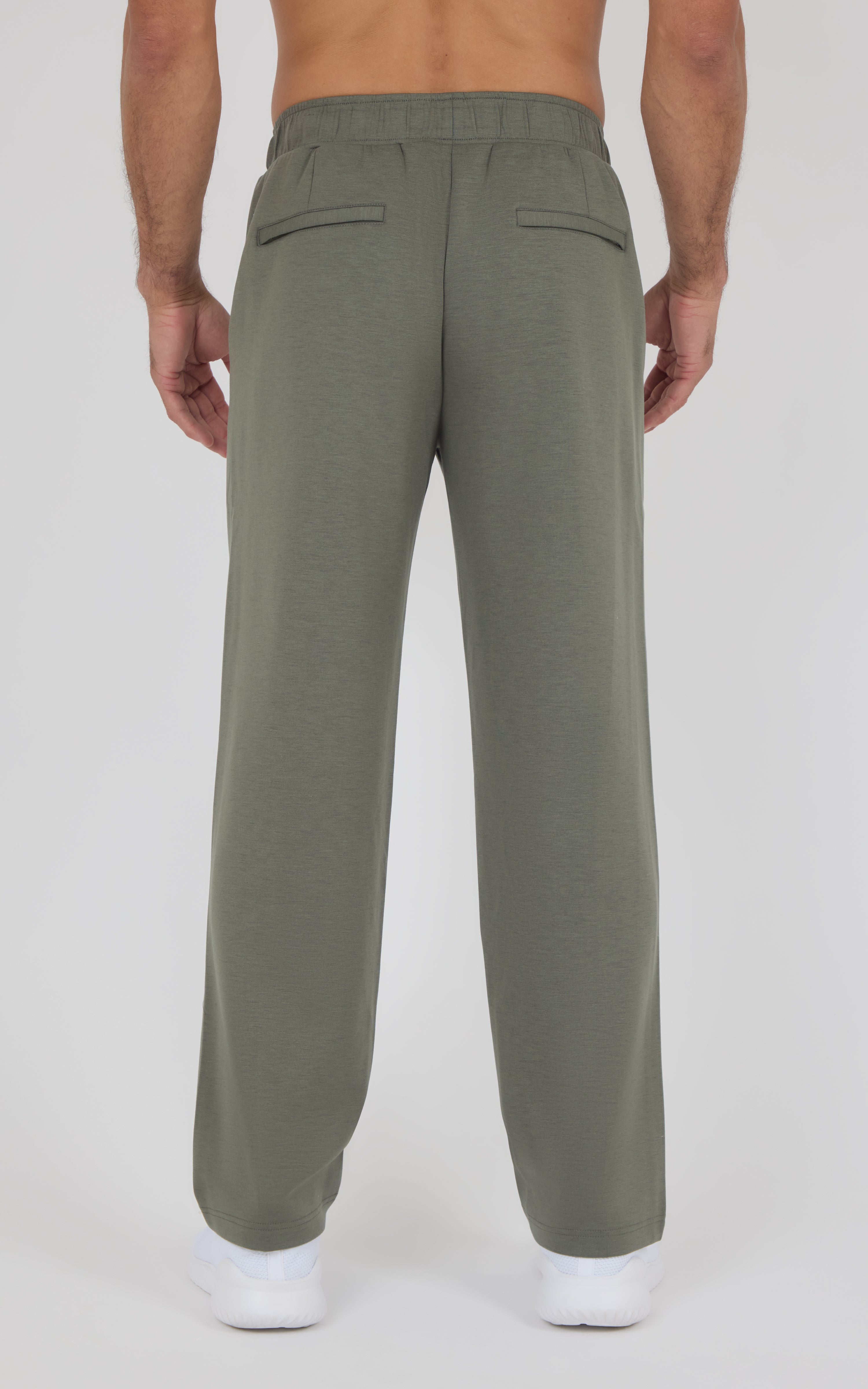 Olive green straight-leg pants with elastic waistband and back welt pockets, relaxed fit on model.