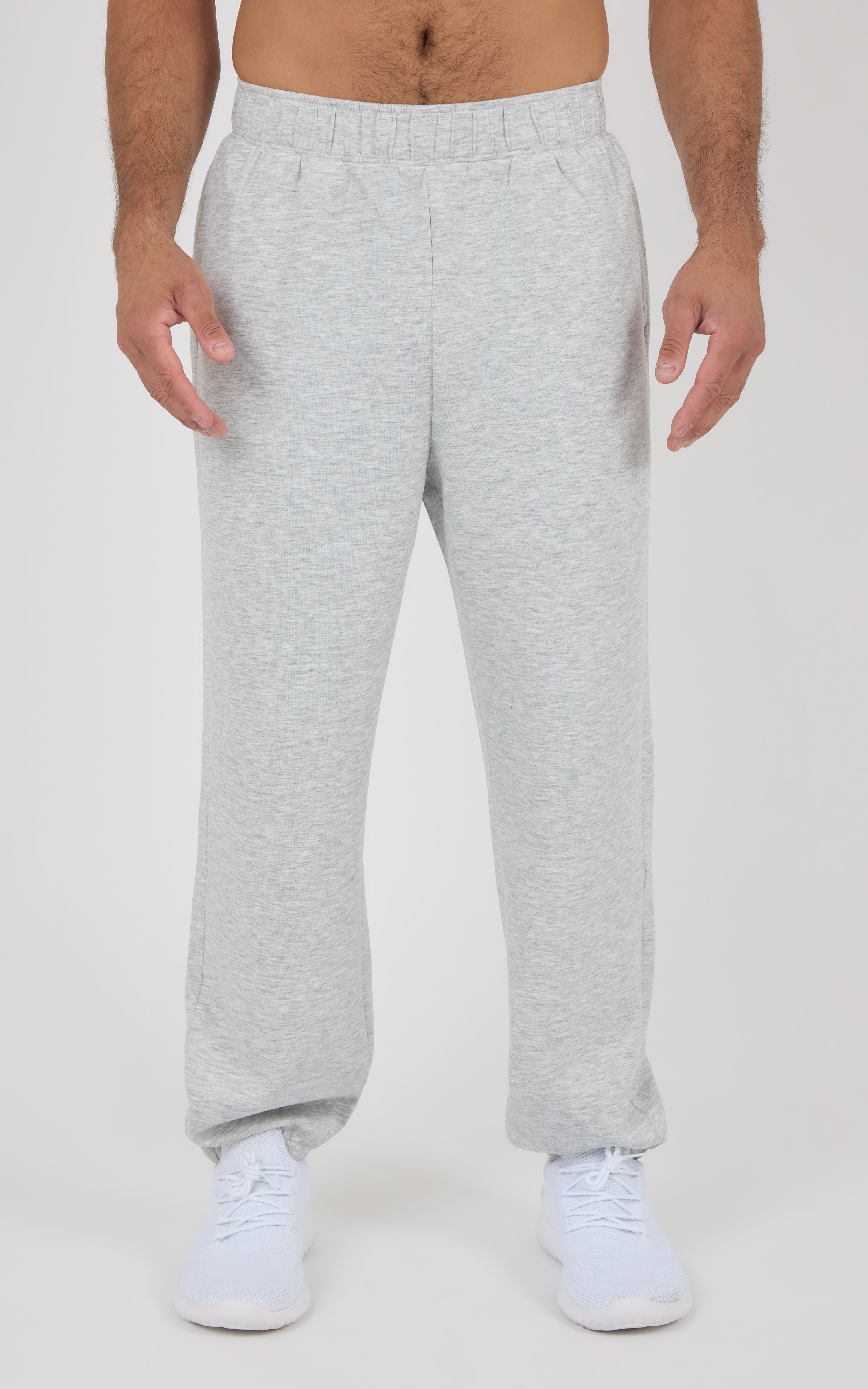 Light gray jogger pants with elastic waistband and side pockets, tapered legs, soft cotton blend fabric.