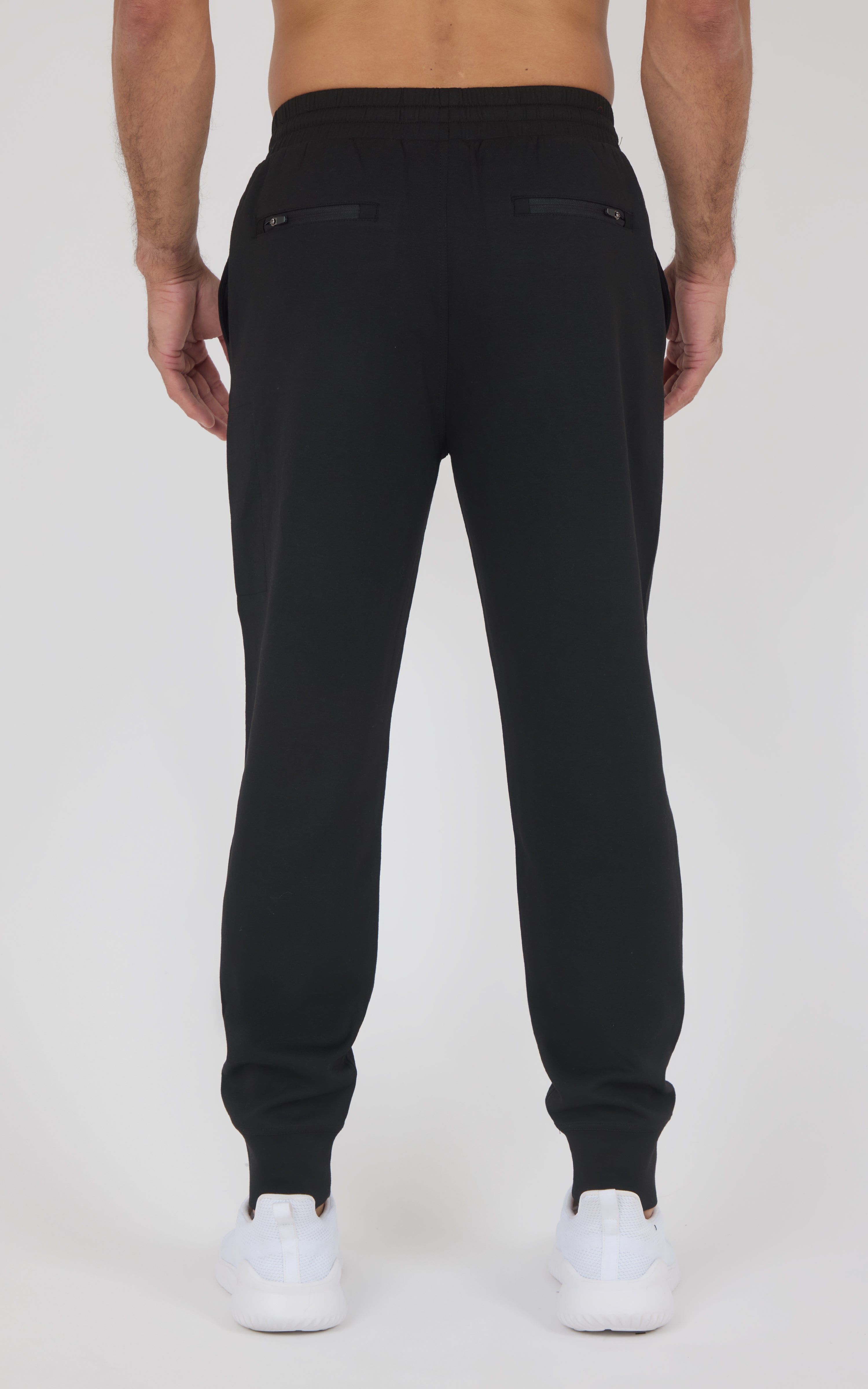 Black slim-fit jogger pants with elastic waistband and cuffed ankles, made from soft lightweight fabric.