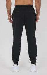 Black slim-fit jogger pants with elastic waistband and cuffed ankles, made from soft lightweight fabric.