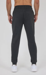 Black soft-knit jogger pants with a tapered fit, elastic cuffs, and back pockets, shown from behind.