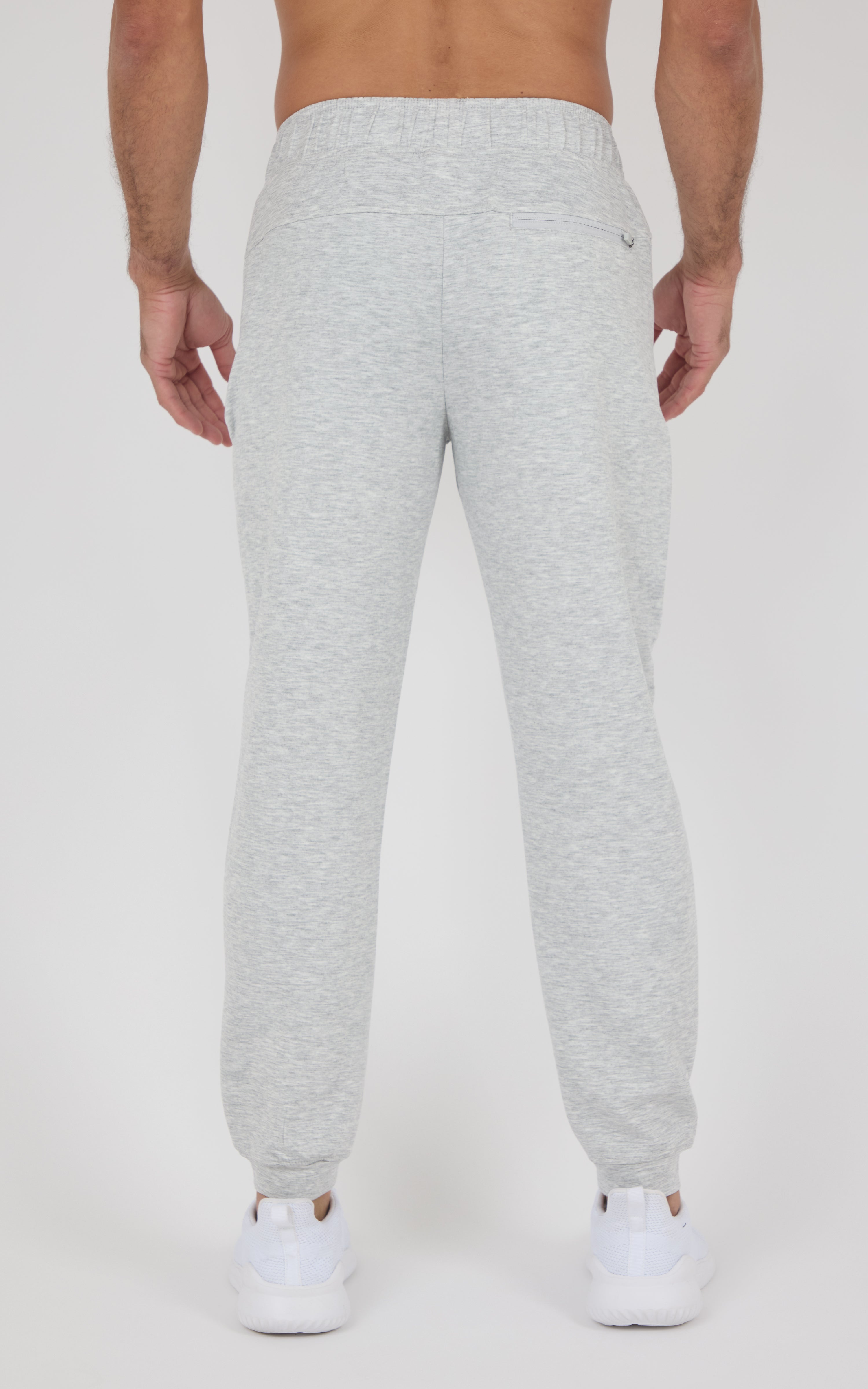 Light gray Softlite joggers with a tapered fit, elastic cuffs, and a back waistband, shown from behind.