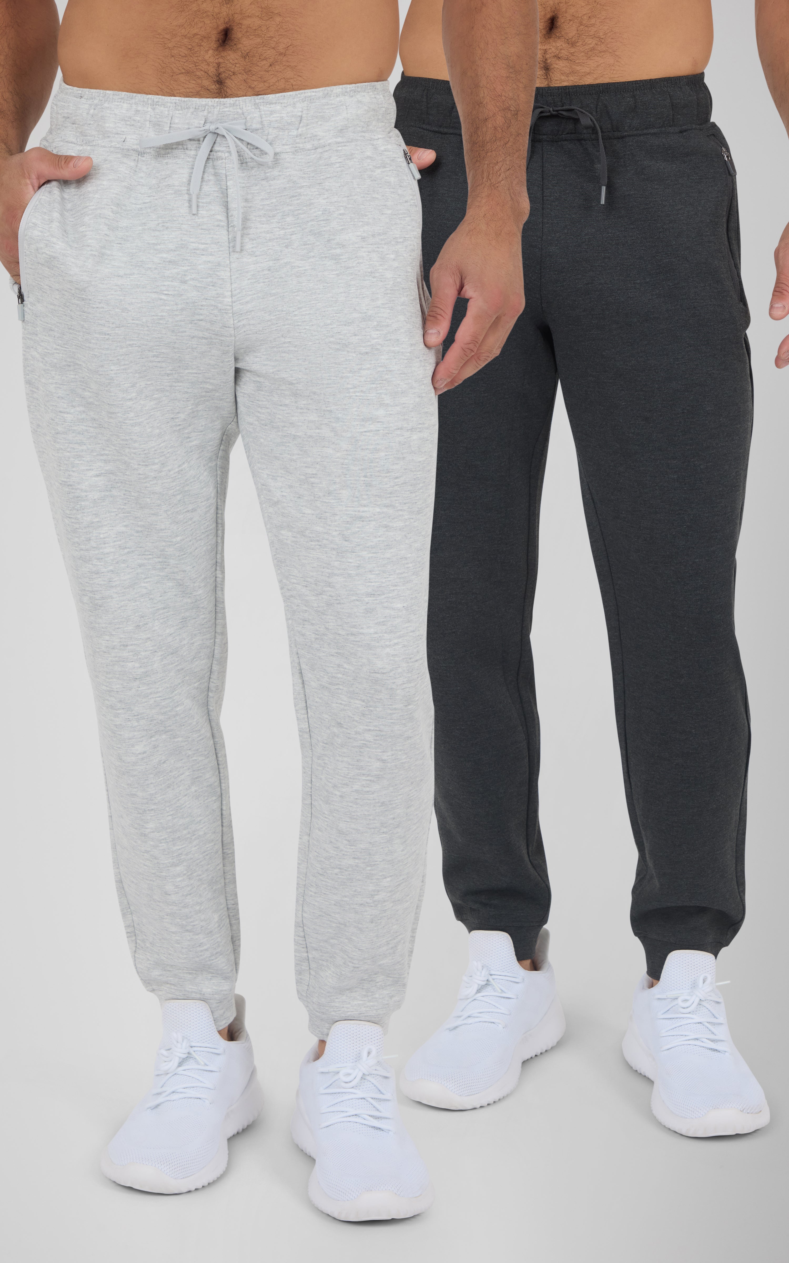 Two men model soft joggers in light gray and black, each with elastic cuffs and white sneakers.