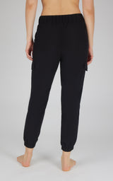 Black cargo jogger pants with side pockets and elastic cuffs, shown from the back.