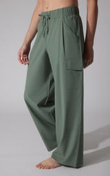 Earthy olive wide leg cargo pants with drawstring waist and large side pockets.