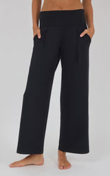 Black high-waisted wide-leg trousers with a smooth finish, relaxed fit, and side pockets.