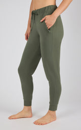 Women's olive green joggers with side pockets, drawstring waist, and ribbed cuffs.