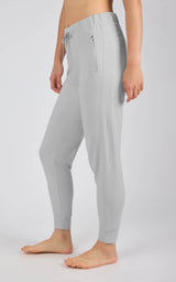 Light gray tapered joggers with an elastic drawstring waist, side pockets, and fitted ankle cuffs.