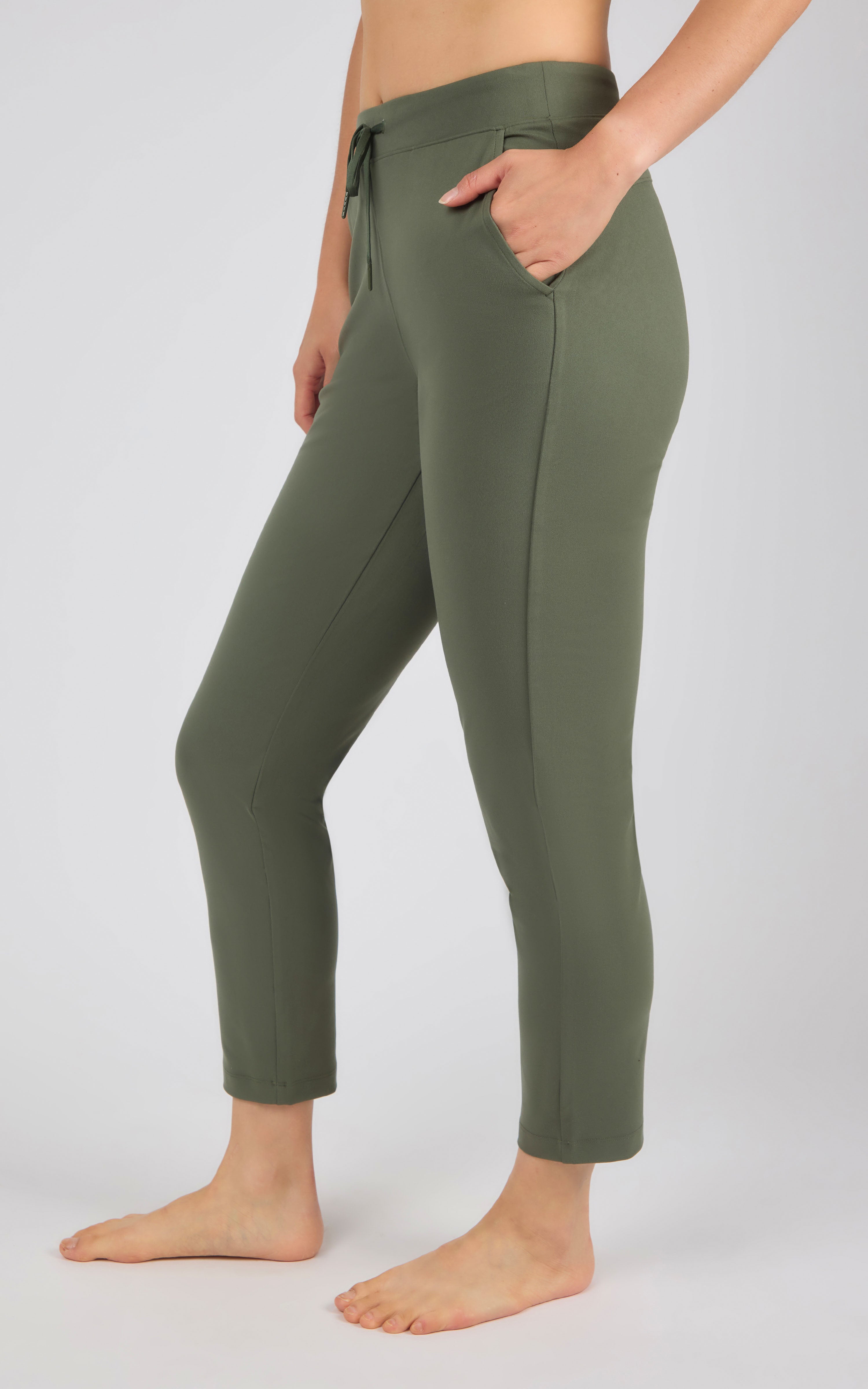 Women's straight leg pants in olive green with side pockets and an elastic waistband with drawstring.