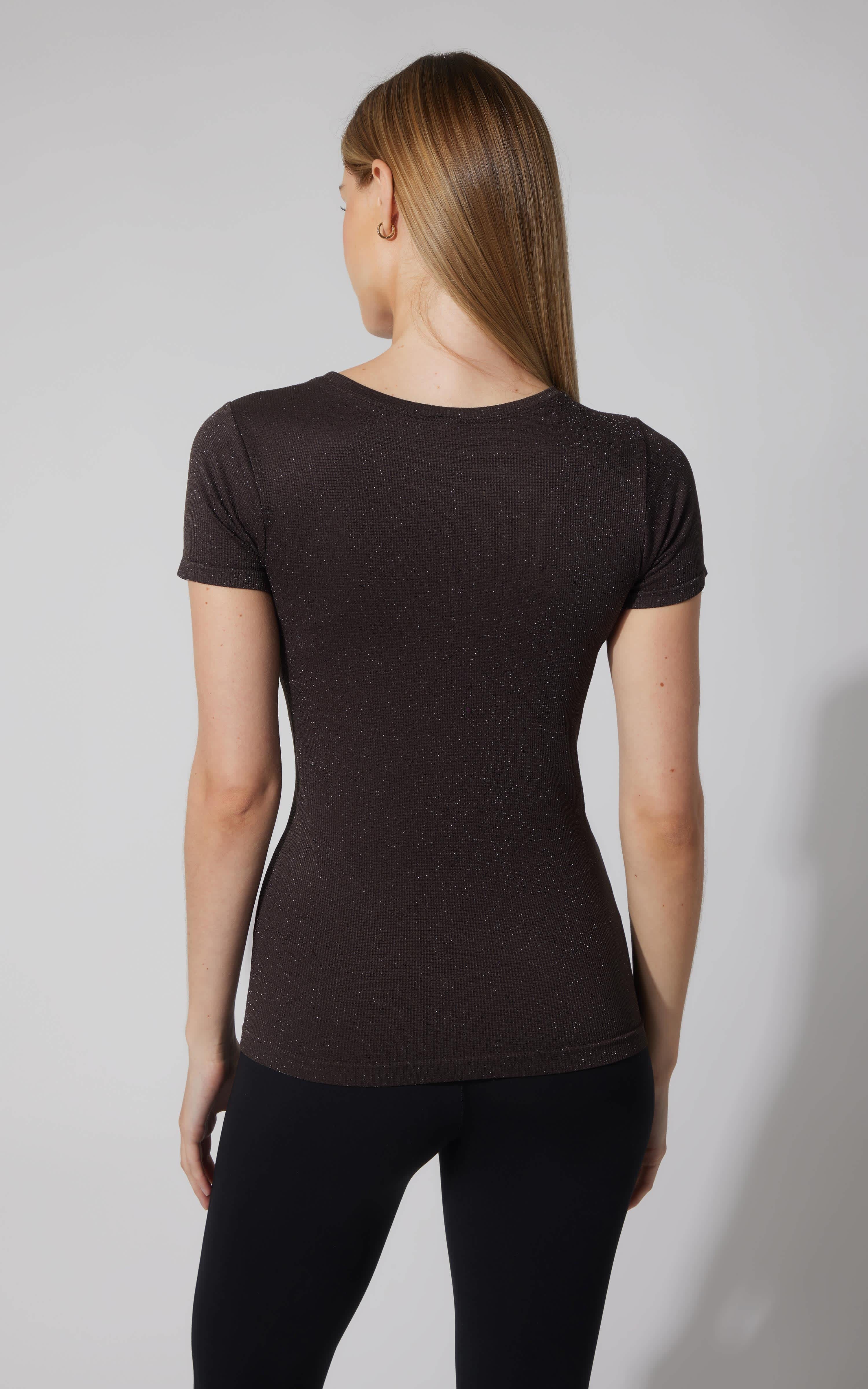 Chocolate Torte seamless short sleeve active shirt with a smooth, fitted silhouette on a model seen from the back.