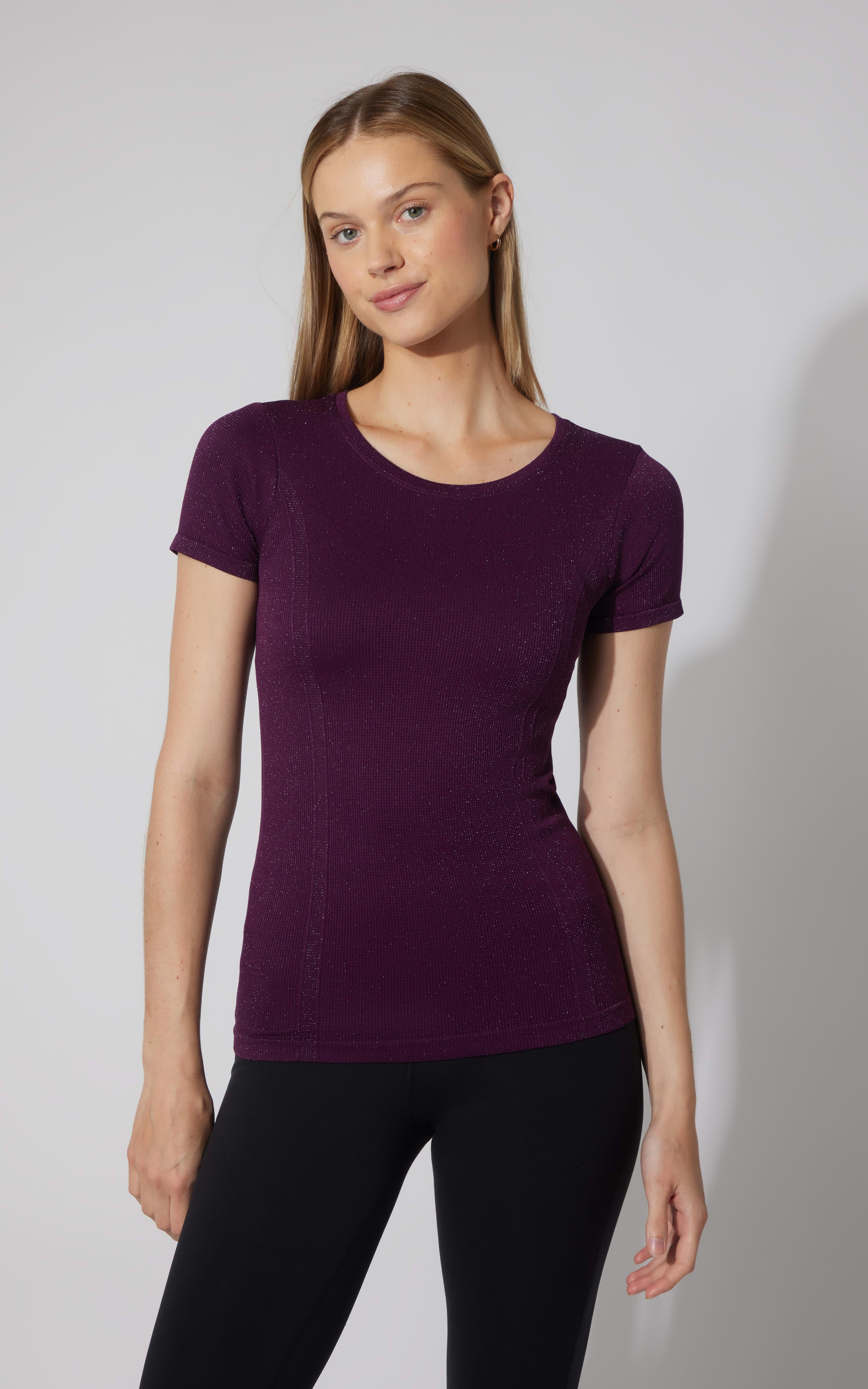 Women's seamless short sleeve active shirt in deep purple with a fitted silhouette.
