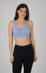 Light blue seamless full-zip sports bra with racerback and supportive fit.