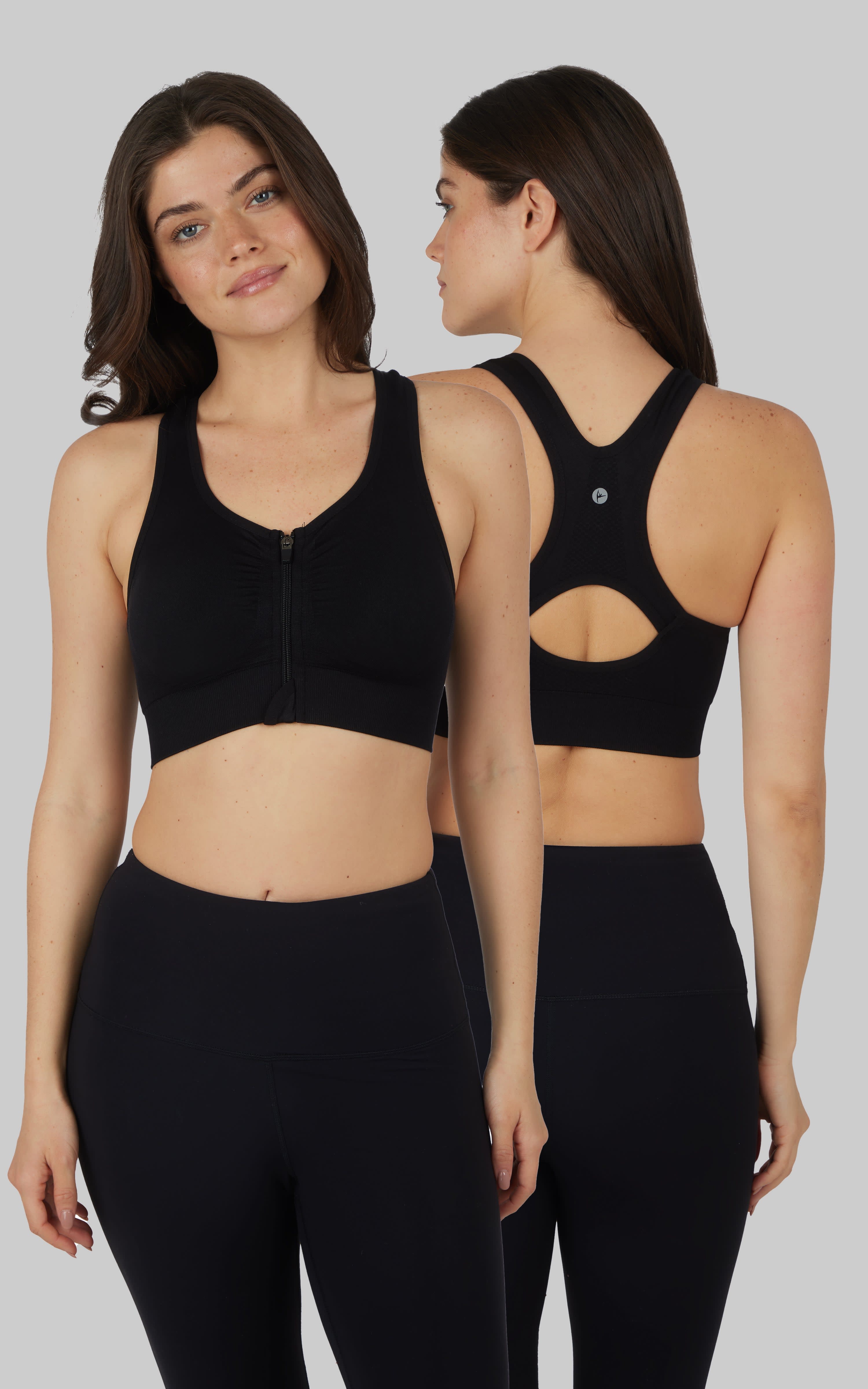 Seamless black full zip sports bra with racerback and cutout detail worn by model front and back view.
