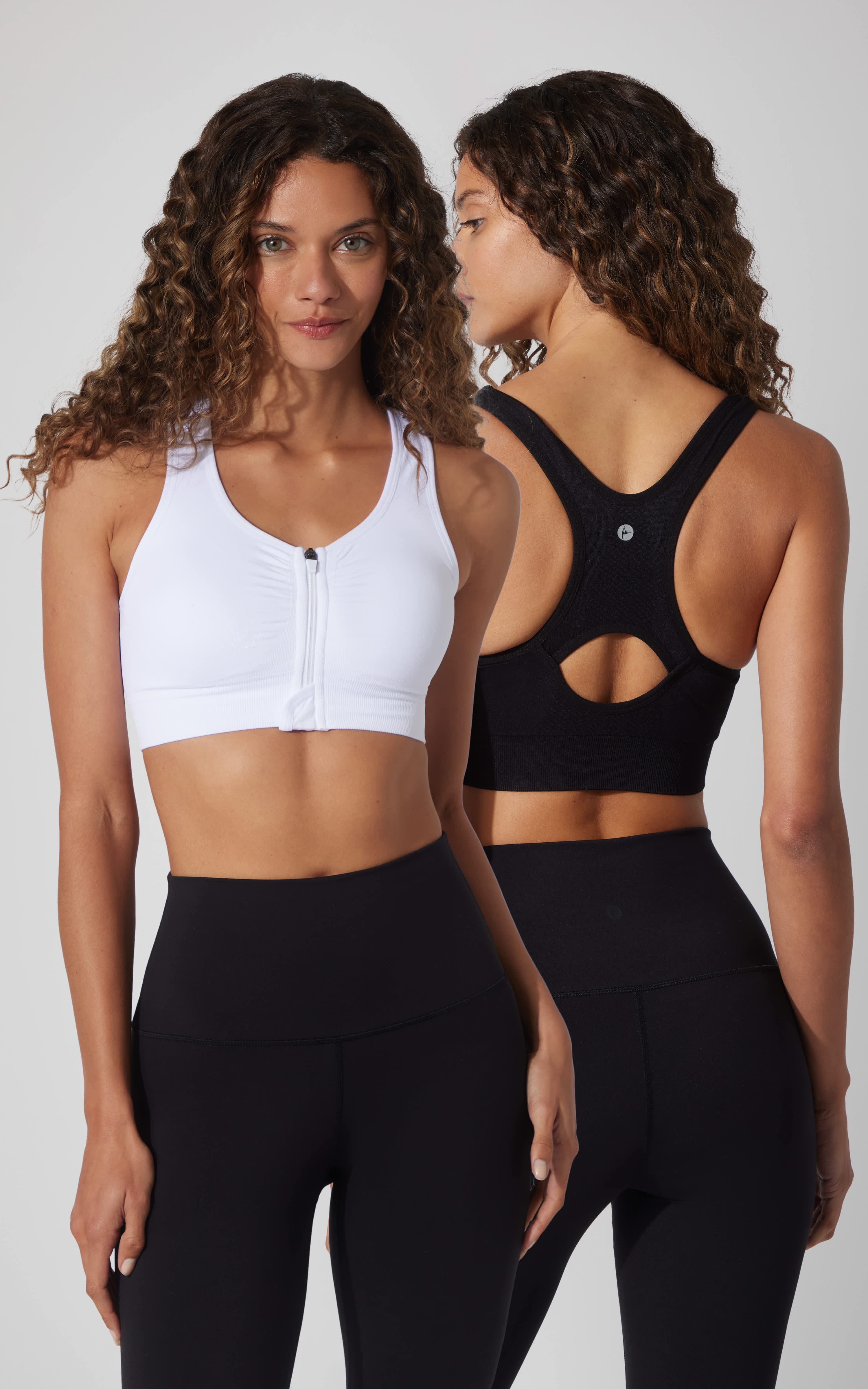 Two-pack full zip seamless bras in black and white, featuring racerback design and front zipper closure.