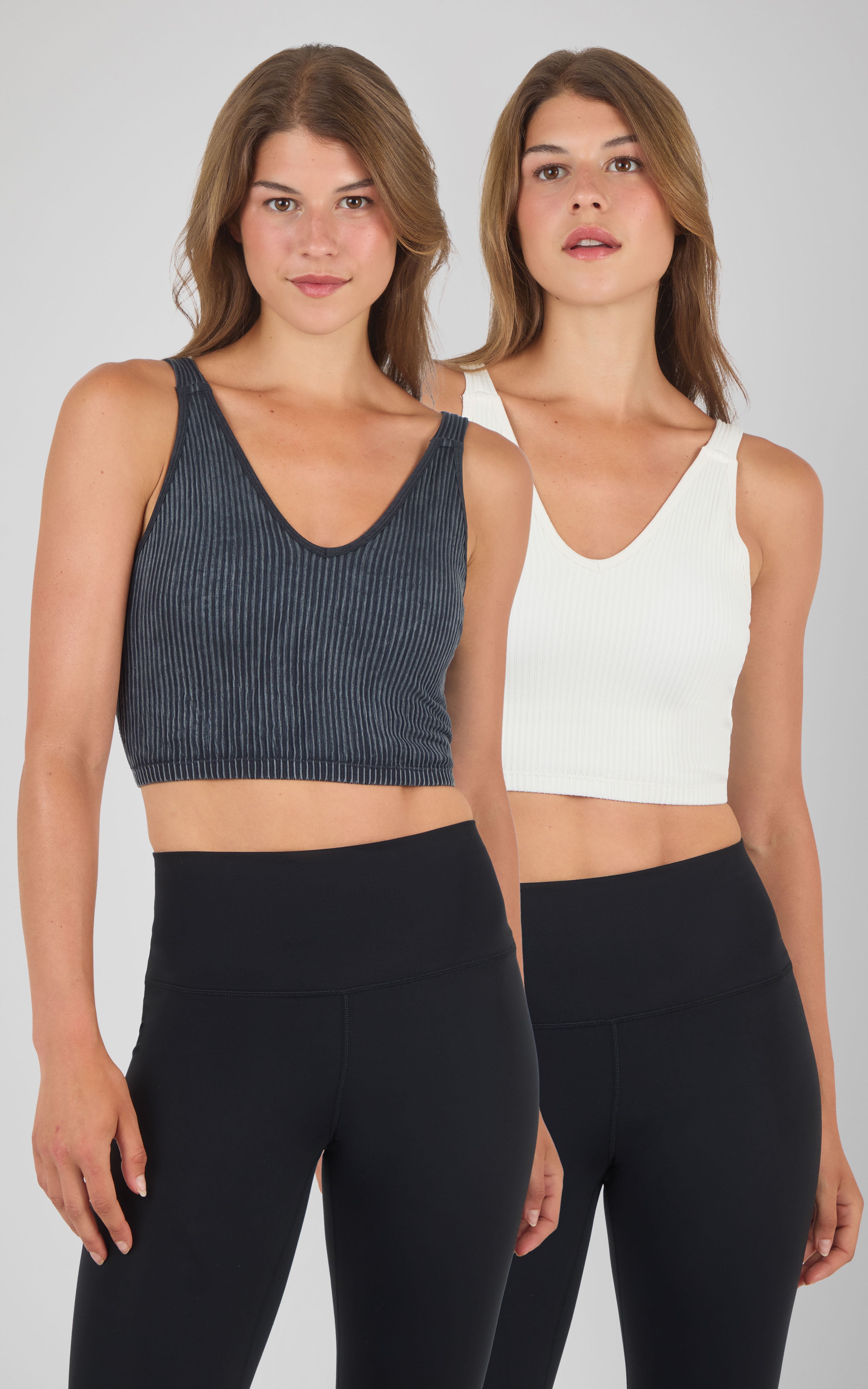 Seamless ribbed tank bra in stone wash black and solid white, scoop neck, slim fit, model worn.