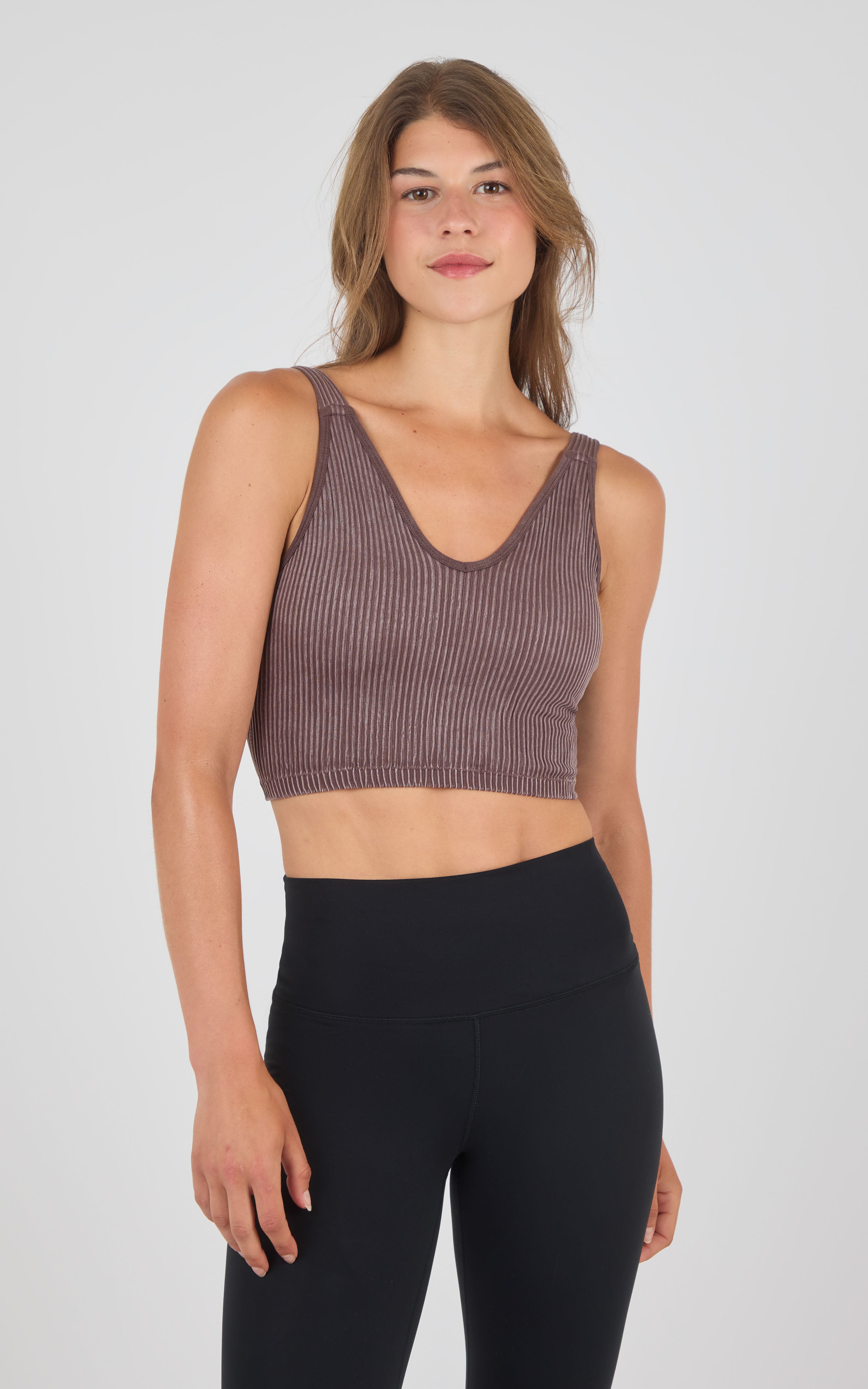 Seamless ribbed crop tank top in stone wash brown with wide straps and scoop neckline.