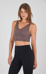 Seamless ribbed crop bra tank in muted brown with scoop neckline and wide straps.