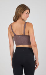Seamless ribbed stone wash mauve bra tank with wide shoulder straps and racerback design.