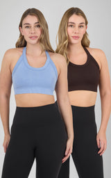 Two women model sleeveless cropped scoop-neck bra tanks, one in light blue and one in dark brown.