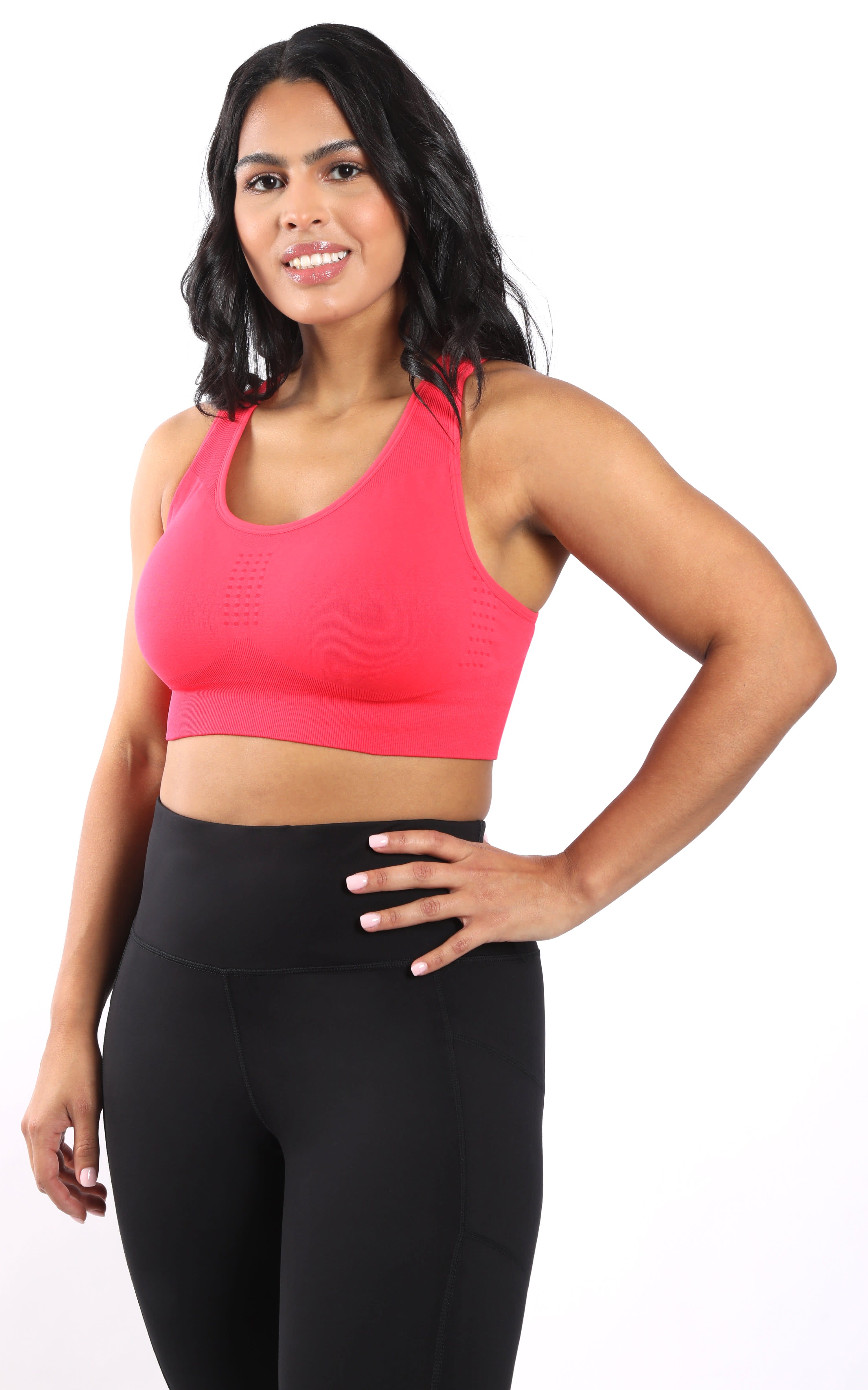 Plus seamless racerback bra in vibrant calypso red on plus-size woman.