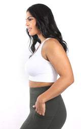 Plus size white seamless racerback bra with wide straps and smooth fabric.