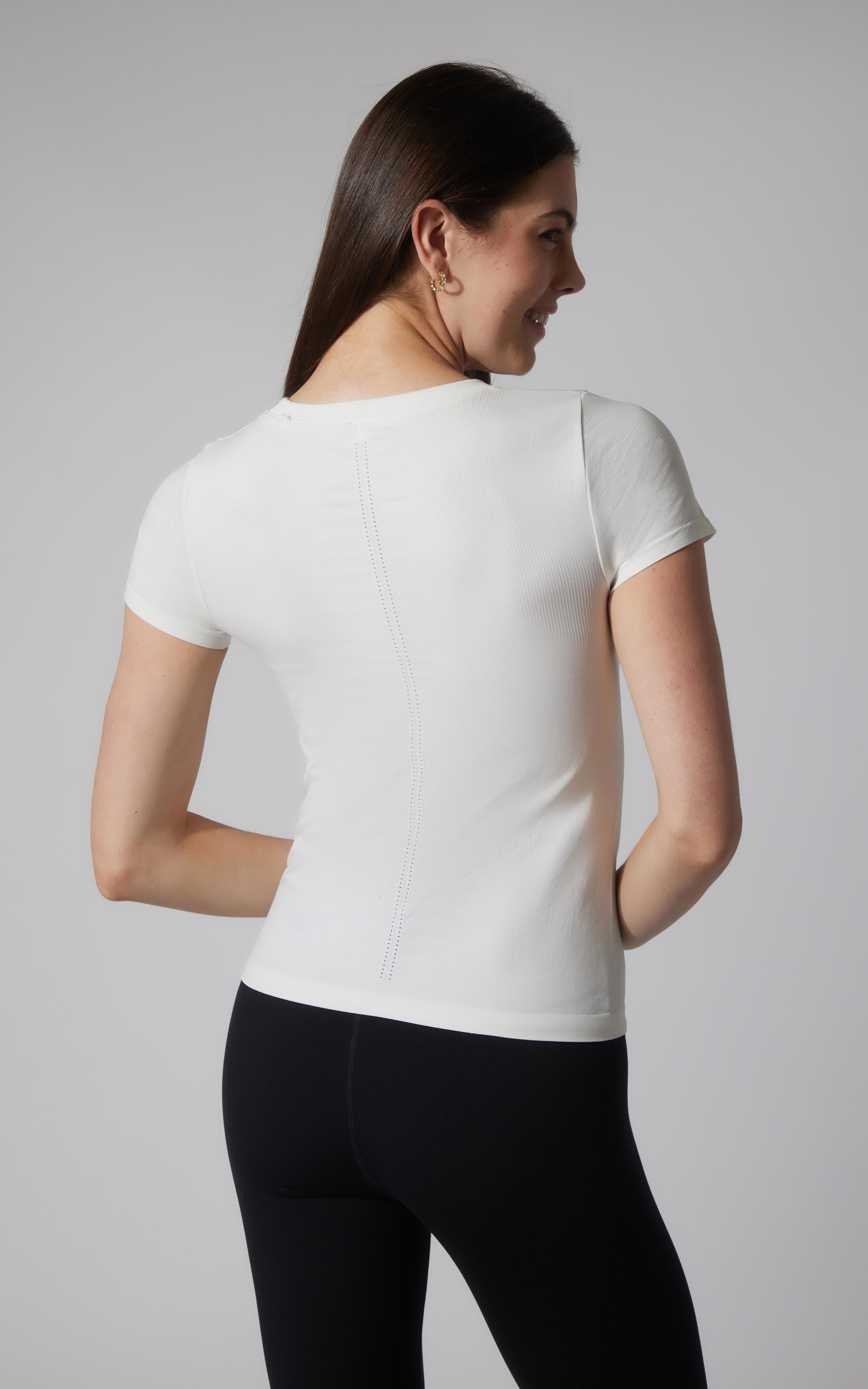Women's seamless short sleeve full-length white tee with fitted silhouette.
