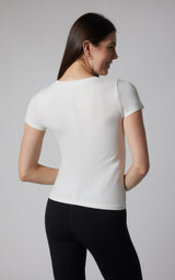 Women's seamless short sleeve full-length white tee with fitted silhouette.