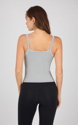Light gray ribbed seamless tank top with thin straps on female model back view.