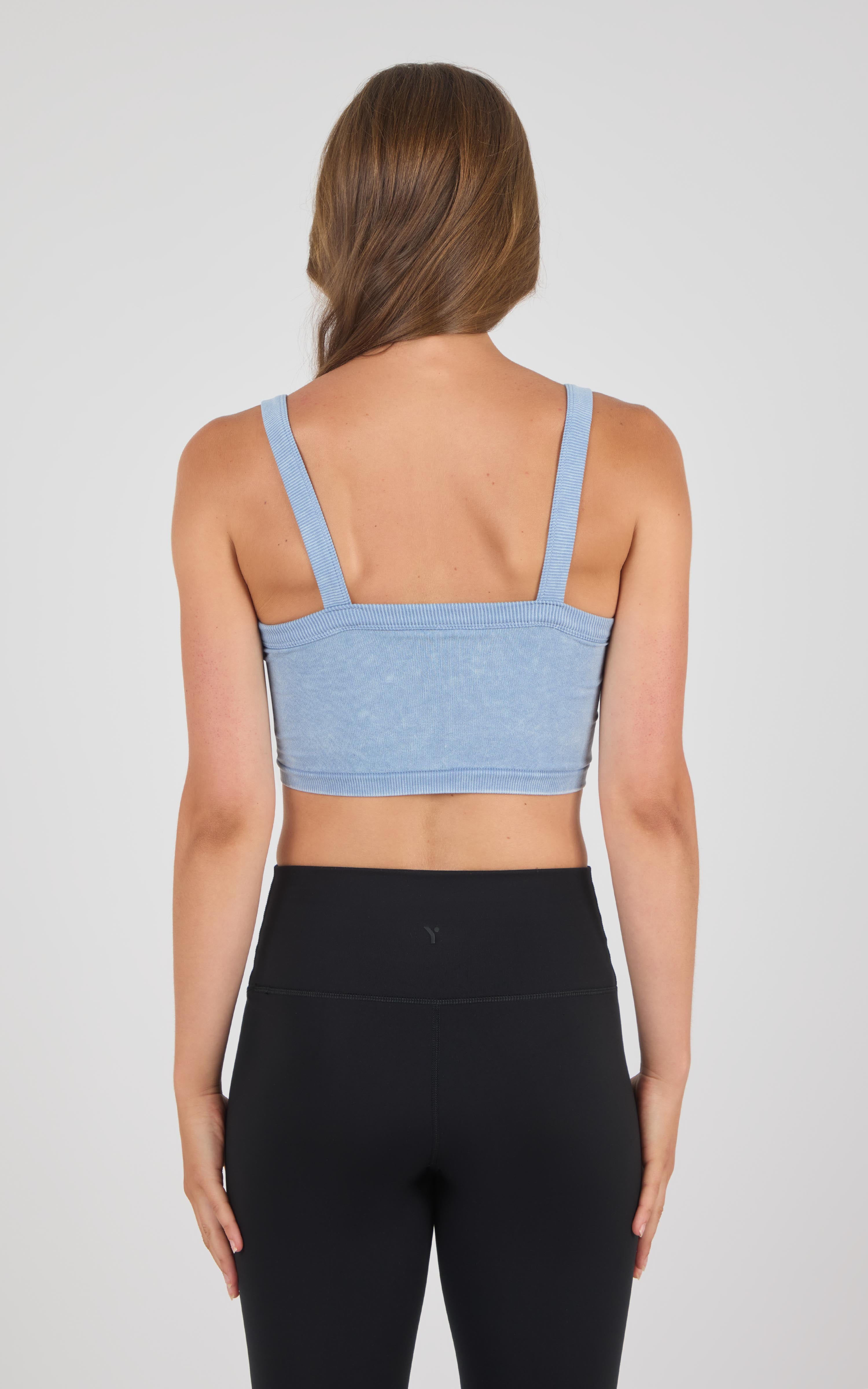 Light blue seamless bra tank with wide straps, square back neckline, and ribbed texture.