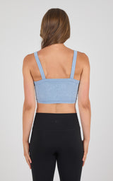 Light blue seamless bra tank with wide straps, square back neckline, and ribbed texture.