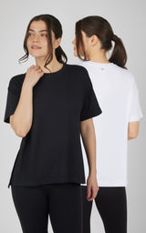 Two boxy short-sleeve tops in black and white, with crew necks and a relaxed high-low hem.