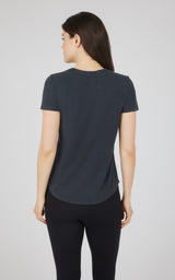 Women's short-sleeve black cotton jersey crew neck tee shown from back.