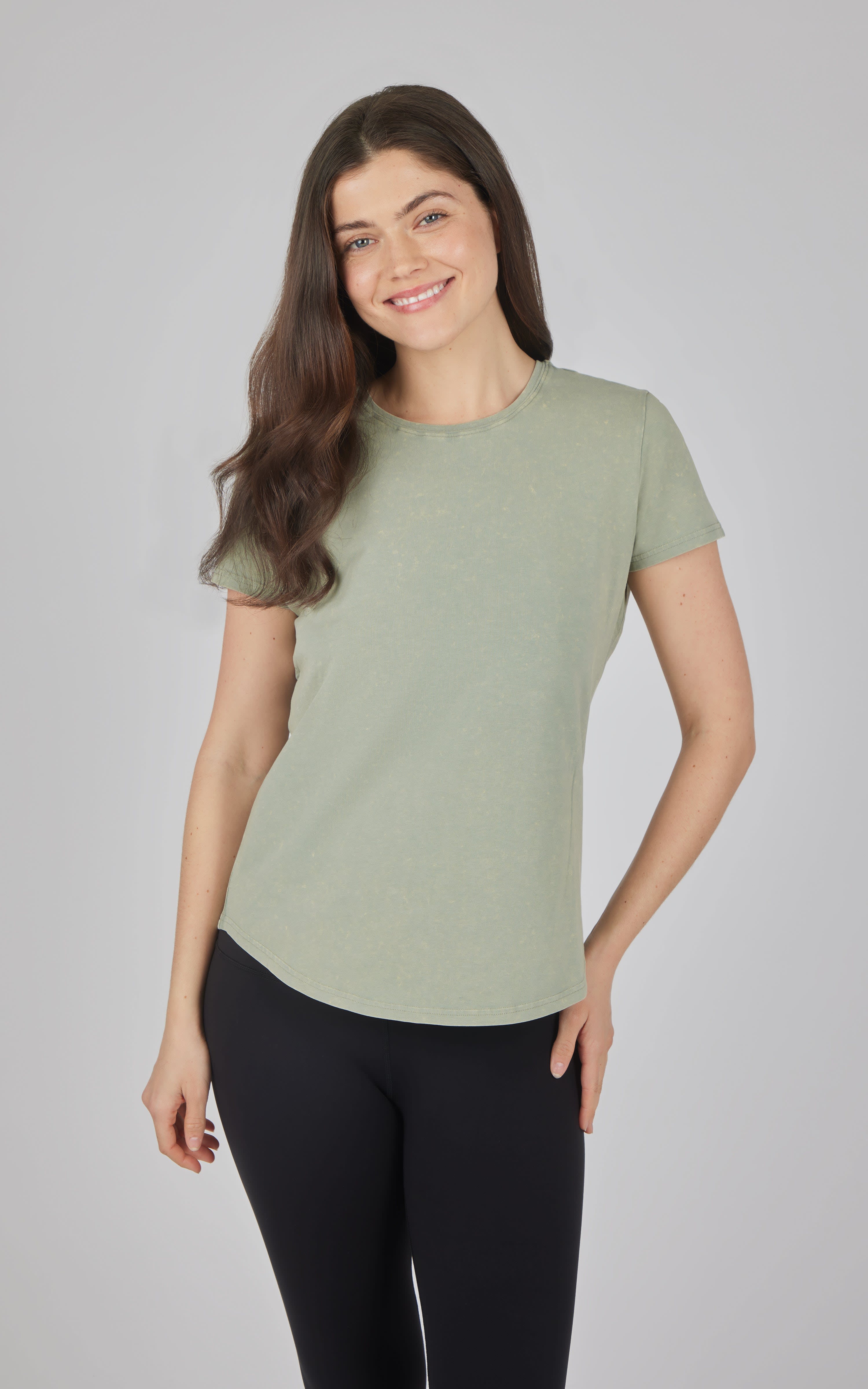 Light green acid wash cotton jersey crew neck tee with short sleeves on model.