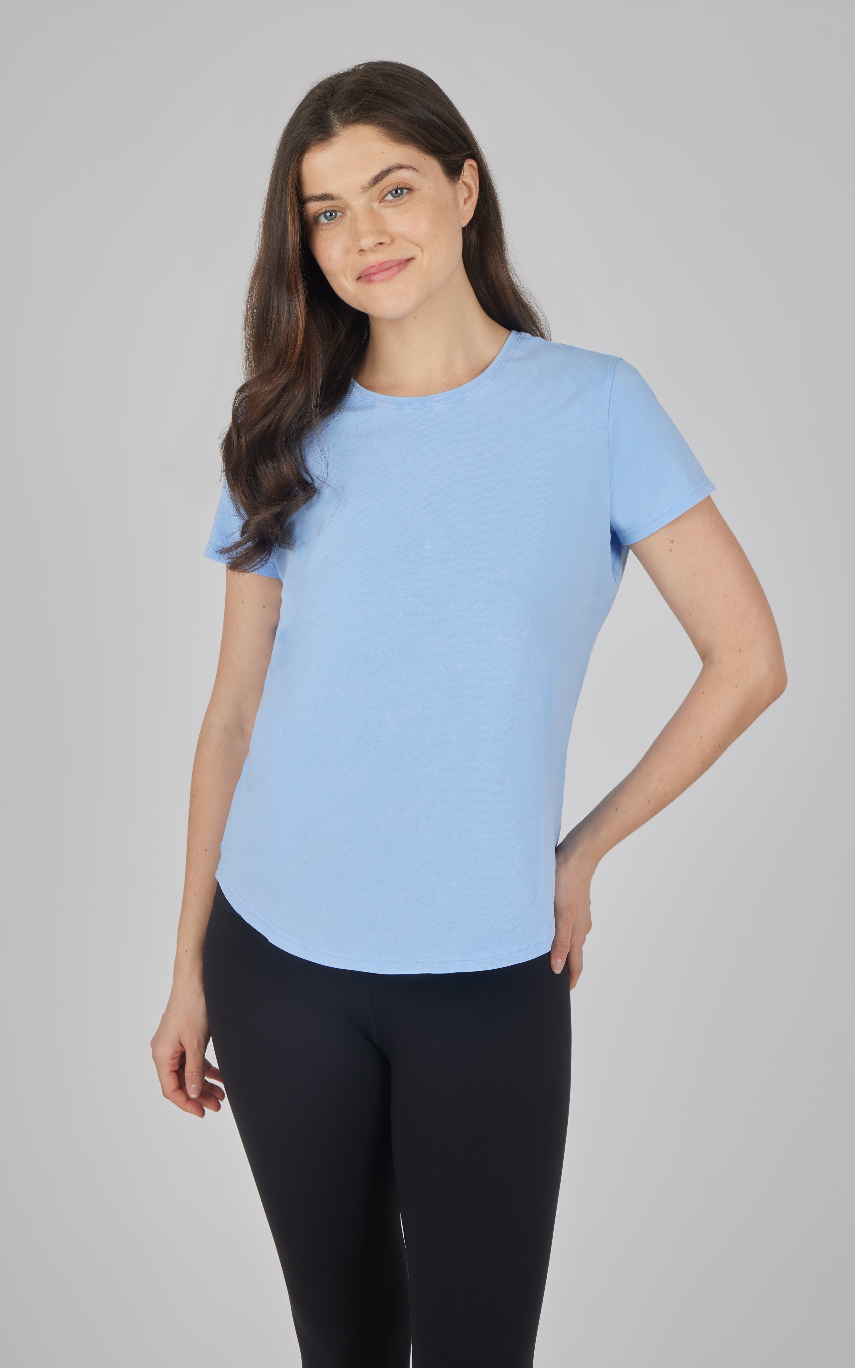 Light blue acid wash cotton jersey crew neck tee with short sleeves and curved hem.