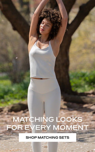 Woman in athletic wear stretching outdoors "Matching Looks for Every Moment Shop Matching Sets"