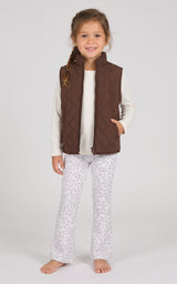 Toddler girl wearing a brown quilted zip vest over a cream long-sleeve top with light gray flare pants.