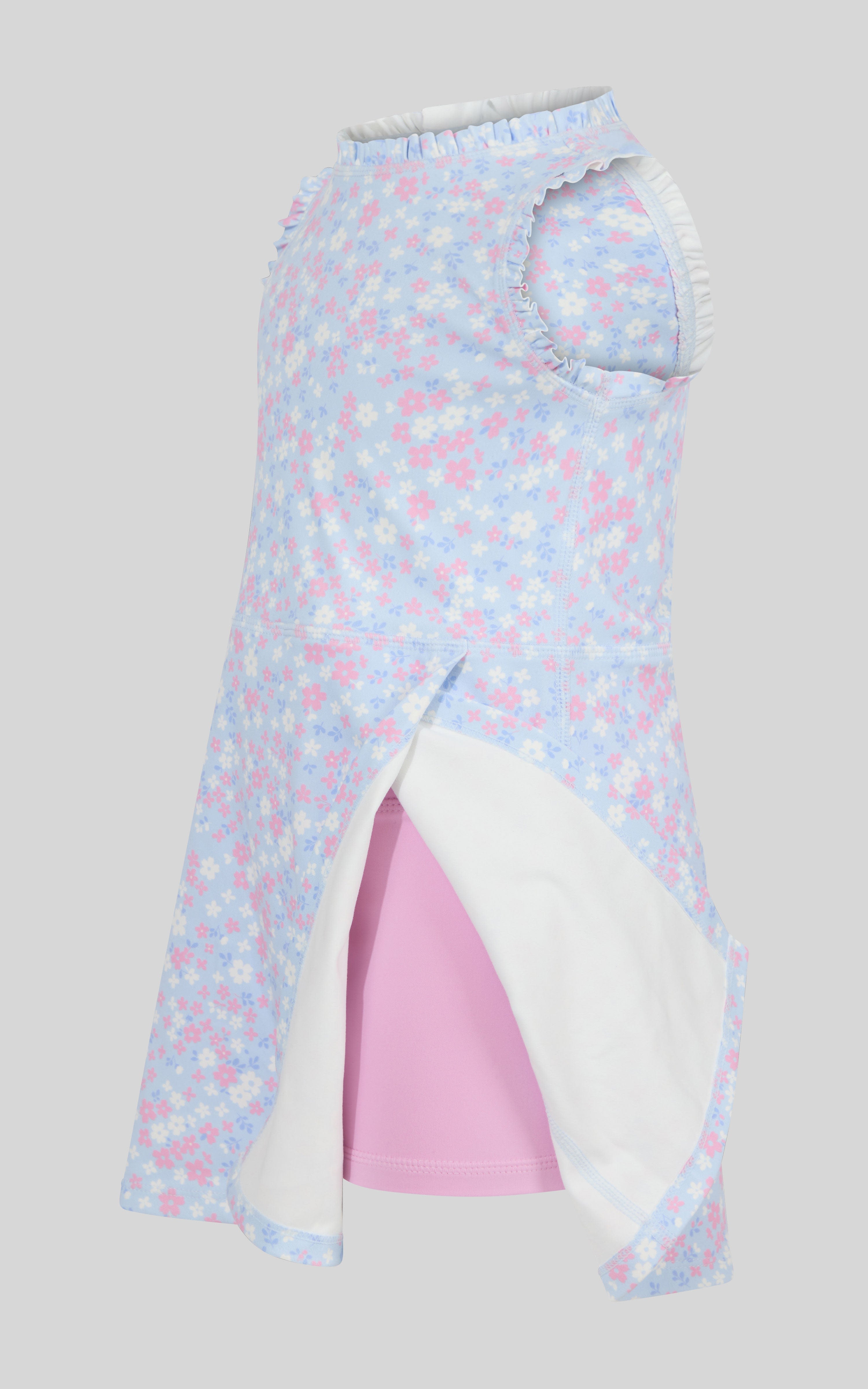 Toddler dress with pink and blue floral ruffles and attached bow scrunchie on hanger.