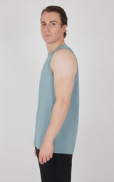 Men's sleeveless muscle tank in muted blue with a relaxed fit and round neckline.