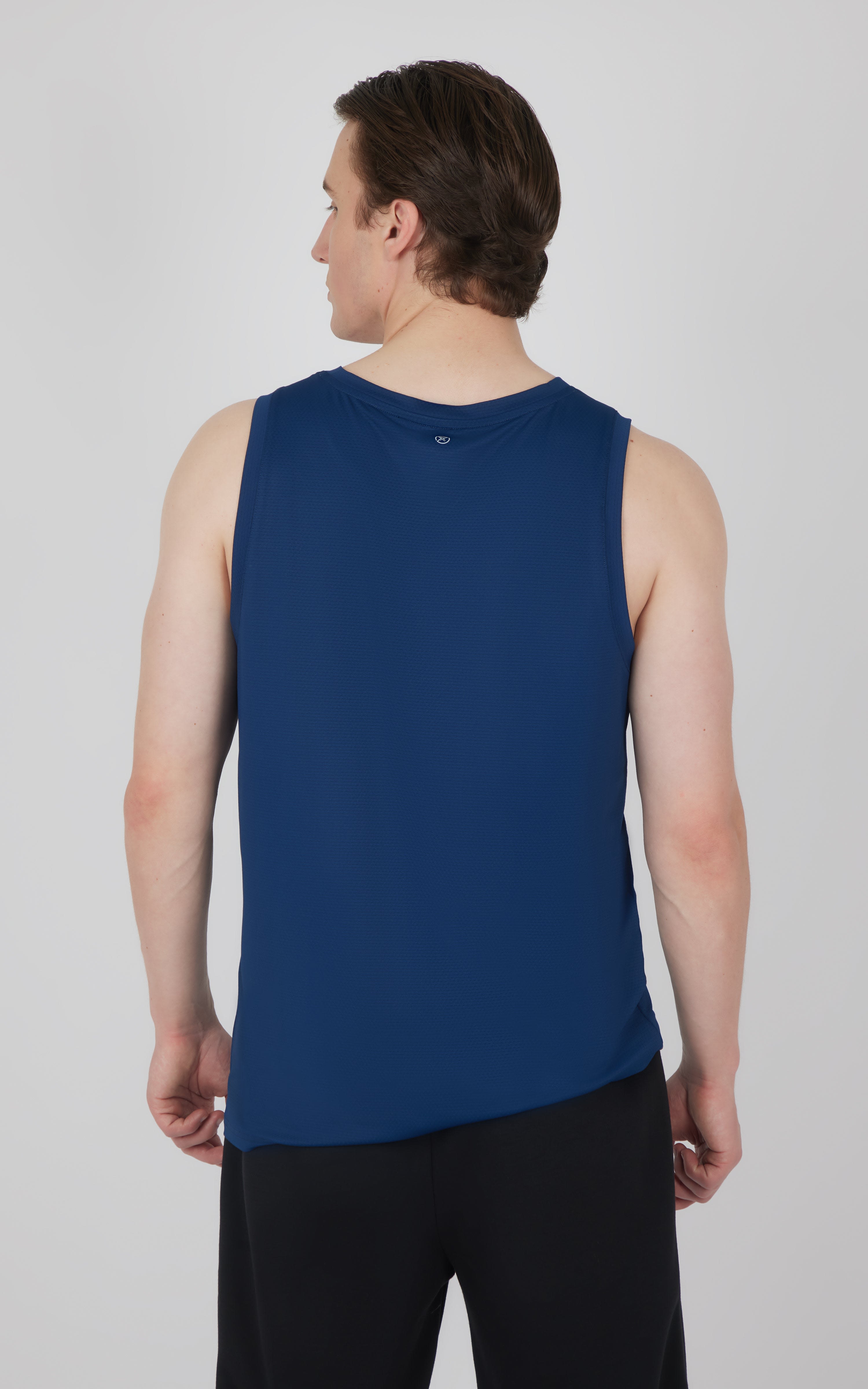 Men's muscle tank in solid deep blue with a round neck and racerback design.