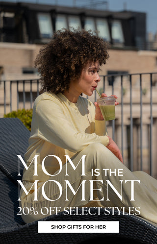 Woman in a yellow lounge set sitting outdoors with a drink, promotional text for 