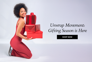 A girl holding red gift boxes. Unwrap Movement:
Gifting Season is Here
Shop Now