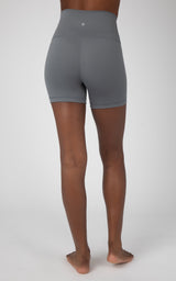 Heather grey 5-inch high-rise biker shorts with smooth fabric and subtle logo on back waistband.