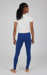 Girl wearing Bellwether blue ankle leggings with a fitted silhouette and smooth waistband, paired with a white short-sleeve.