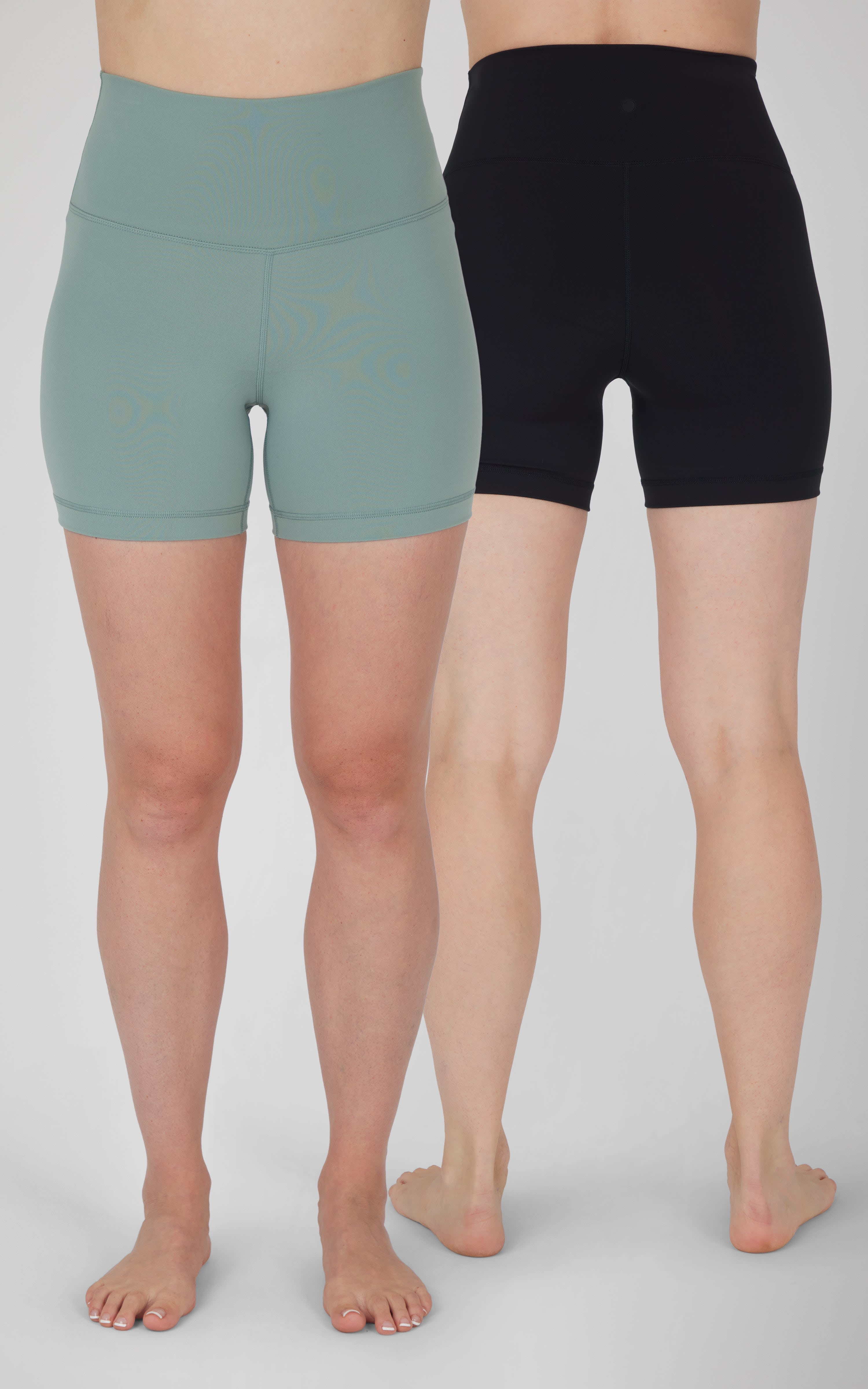 Two-pack women's 5-inch biker shorts in muted green and solid black with high waistbands.